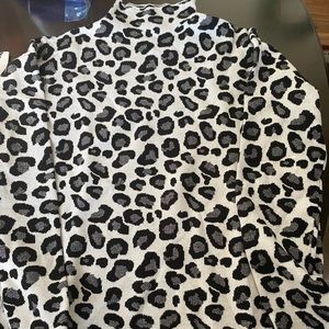 Women’s Sweater tan with black and gray spots.